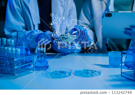biotechnologist testing new chemical substances in a laboratory. 113242749