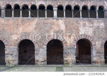 Medieval Stone Archway Facade with Arched Windows Medieval Stone Archway Facade with Arched Windows 113242924