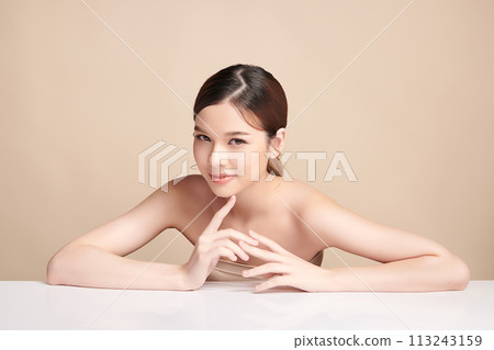 Beautiful young asian woman with clean fresh skin on beige background, Face care, Facial treatment, Cosmetology, beauty and spa, Asian women portrait. 113243159