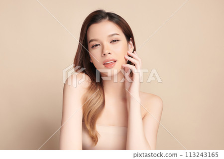 Beautiful young asian woman with clean fresh skin on beige background, Face care, Facial treatment, Cosmetology, beauty and spa, Asian women portrait. Beautiful young asian woman with clean fresh skin on beige background, Face care, Facial treatment, Cosmetology, beauty and spa, Asian women portrait. 113243165