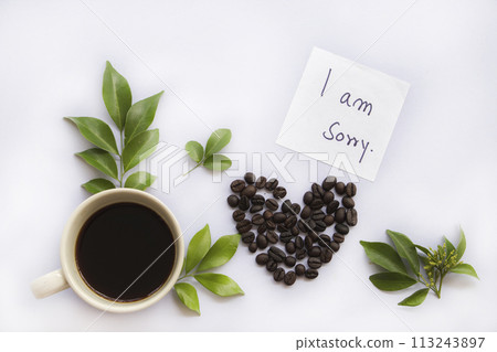 i am sorry message card handwriting with hot roasted coffee espresso and bean hearts  113243897