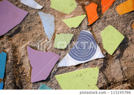 Flooring with broken tiles in pavement pattern, fixing broken urban roads Flooring with broken tiles in pavement pattern, fixing broken urban roads 113245766