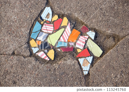 Flooring with broken tiles in pavement pattern, fixing broken roads Flooring with broken tiles in pavement pattern, fixing broken roads 113245768