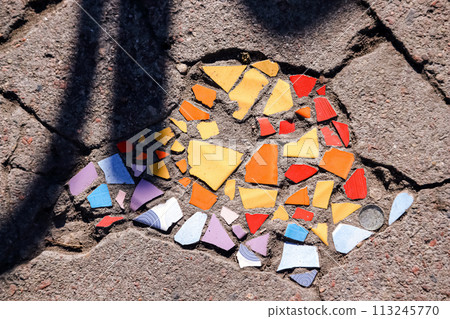 Flooring with broken tiles in pavement pattern, fixing broken roads Flooring with broken tiles in pavement pattern, fixing broken roads 113245770