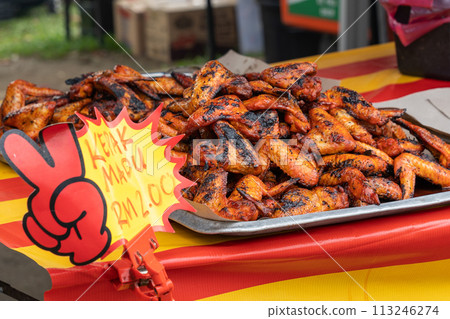 Tasty Honey chicken wings for sale at the Ramadan bazaar. English translation for malay wording is honey chicken wings. 113246274