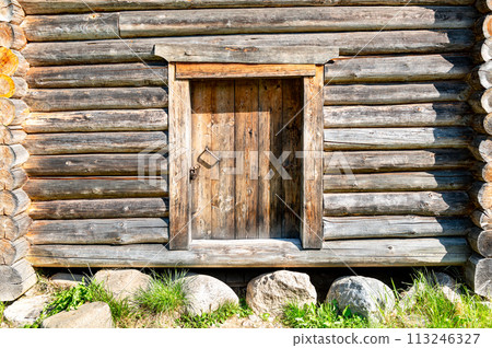 Door in old wooden log house. Vintage wooden house 113246327