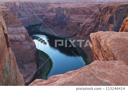 River Flowing Through Canyon Surrounded by Large Rocks River Flowing Through Canyon Surrounded by Large Rocks 113246414