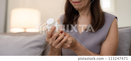 Medicine and healthcare of senior woman taking daily pill for illness, medication and sick elderly with medical drugs, vitamin or supplements in his hand Medicine and healthcare of senior woman taking daily pill for illness, medication and sick elderly with medical drugs, vitamin or supplements in his hand 113247471