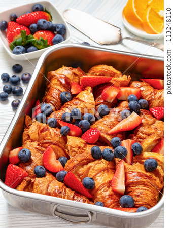 berry croissant casserole in baking dish, top view 113248110