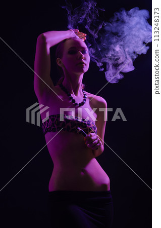 woman blowing smoke woman blowing smoke 113248173