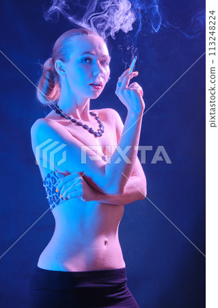 woman blowing smoke 113248224