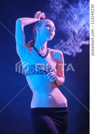 woman blowing smoke 113248230