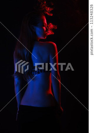 woman blowing smoke woman blowing smoke 113248326
