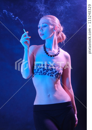 woman blowing smoke woman blowing smoke 113248329