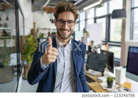 European businessman showing thumbs up in his office, success and achievement concept 113248786