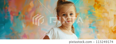 European child girl 4-6 years old in a white T-shirt without a pattern against the background of a colored wall, banner 113249174