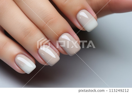 Calm beauty delicate nail design for a girl, beautiful female hands with a well-groomed neutral manicure 113249212