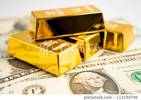 Gold bar on US dollar banknotes money and graph, economy finance exchange trade investment concept. Gold bar on US dollar banknotes money and graph, economy finance exchange trade investment concept. 113249746
