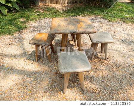 The small wooden chair and table set for relaxing time. 113250585