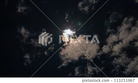 Clouds flowing on a bright night with a full moon Clouds flowing on a bright night with a full moon 113251067