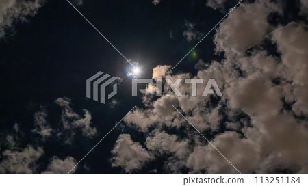 Clouds flowing on a bright night with a full moon 113251184