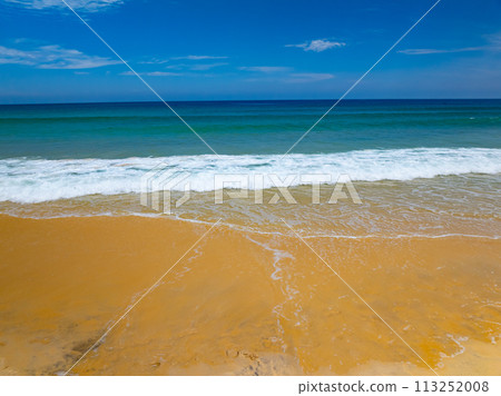 Summer sea waves crashing on sandy shore seascape background,Wide angle lens ocean nature background 113252008