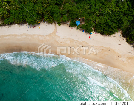 Summer sea waves crashing on sandy shore seascape background,Wide angle lens ocean nature background 113252011