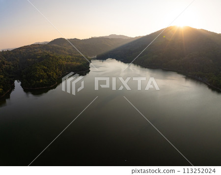 Amazing sunset or sunrise sky over sea lake,Beautiful colorful light of nature sunset background 113252024