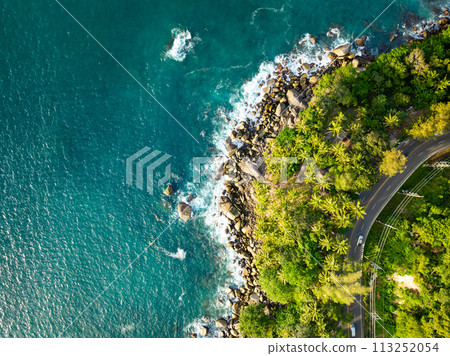 Amazing tropical seashore landscape background,Top view waves crashing on rocks Amazing tropical seashore landscape background,Top view waves crashing on rocks 113252054