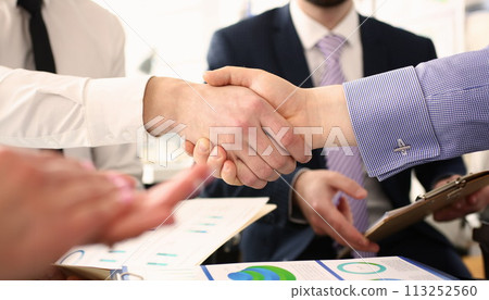 Group of businessmen shaking hands after productive meeting Group of businessmen shaking hands after productive meeting 113252560