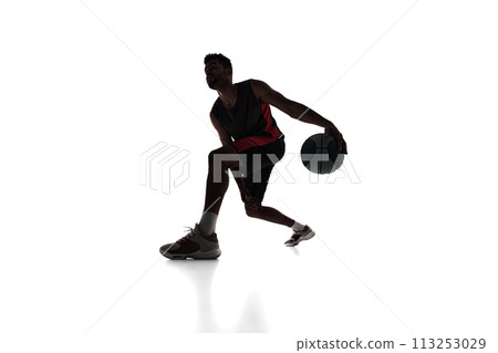 Silhouette of concentrated male athlete, basketball player in motion, dribbling ball isolated on white background Silhouette of concentrated male athlete, basketball player in motion, dribbling ball isolated on white background 113253029