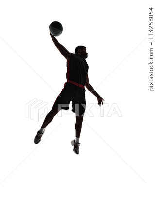 Full-length silhouette of male basketball player, athlete in motion during game, making winning moment isolated on white background. Full-length silhouette of male basketball player, athlete in motion during game, making winning moment isolated on white background. 113253054