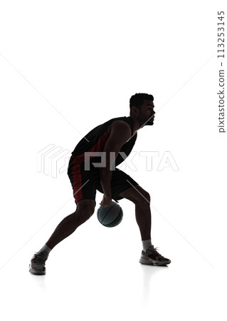 Silhouette of man, basketball player in motion during game, dribble ball, training isolated on white background Silhouette of man, basketball player in motion during game, dribble ball, training isolated on white background 113253145