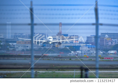 A jet plane landing at Fukuoka Airport 113253417
