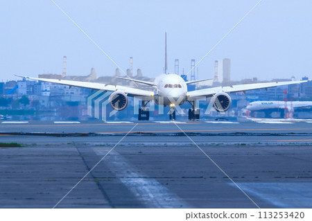 A jet plane landing at Fukuoka Airport A jet plane landing at Fukuoka Airport 113253420