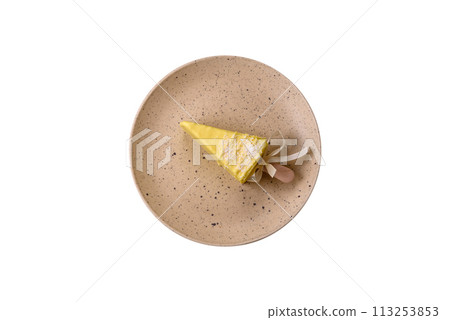 Delicious sweet cheesecake with fruits covered with icing with a wooden stick 113253853