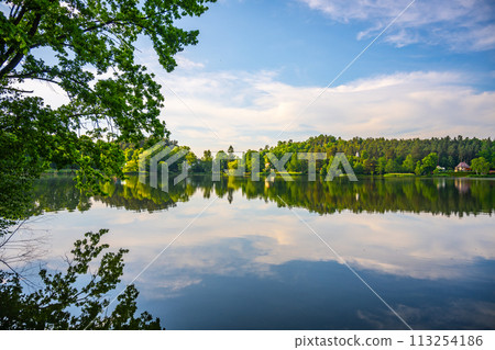 Landscape with Jested Mountain ridge reflected in water of Hamr Lake, or Hamr Pond. Czech Republic Landscape with Jested Mountain ridge reflected in water of Hamr Lake, or Hamr Pond. Czech Republic 113254186