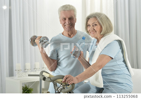 Portrait of happy sporty senior couple exercising Portrait of happy sporty senior couple exercising 113255068