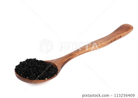 Wooden spoon with black sesame seeds over white background. Wooden spoon with black sesame seeds over white background. 113256409