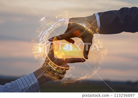 Double exposure of hands showing crop and city . 113256897