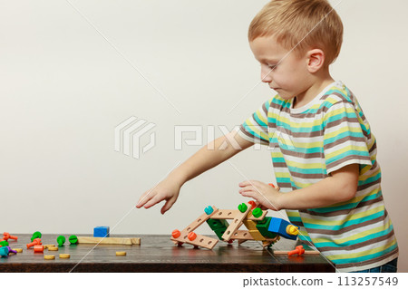Little boy playing with toys having fun Little boy playing with toys having fun 113257549
