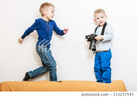 Little boys play with camera. Little boys play with camera. 113257595