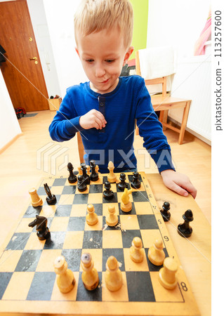 Little boy clever child playing chess thinking, Little boy clever child playing chess thinking, 113257600