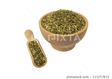 passion flower herb in latin - passiflora incarnata in wooden bowl and scoop isolated on white background. Medicinal herb. 113257615