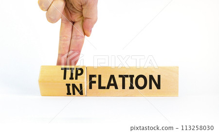 Inflation or tipflation symbol. Concept words Inflation Tipflation on beautiful wooden blocks. Beautiful white background. Businessman hand. Business inflation Tipflation concept. Copy space Inflation or tipflation symbol. Concept words Inflation Tipflation on beautiful wooden blocks. Beautiful white background. Businessman hand. Business inflation Tipflation concept. Copy space 113258030