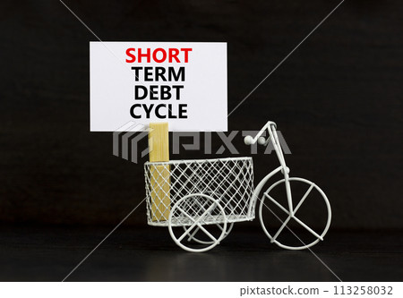 Short term debt cycle symbol. Concept words Short term debt cycle on beautiful white paper on clothespin. Bicycle model. Beautiful black background. Business Short term debt cycle concept. Copy space 113258032