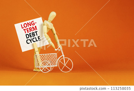 Long-term debt cycle symbol. Concept words Long-term debt cycle on beautiful white paper on clothespin. Bicycle model. Beautiful orange background. Business Long-term debt cycle concept. Copy space. 113258035