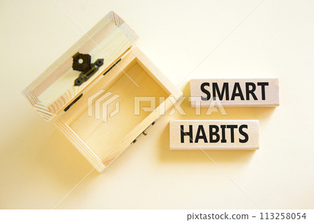 Smart habits symbol. Concept words Smart habits on wooden blocks. Beautiful white table white background. Wooden empthy chest. Business and smart habits concept. Copy space. Smart habits symbol. Concept words Smart habits on wooden blocks. Beautiful white table white background. Wooden empthy chest. Business and smart habits concept. Copy space. 113258054