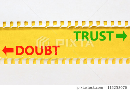 Trust or doubt symbol. Concept word Trust or Doubt on beautiful yellow paper. Beautiful white paper background. Business and trust or doubt concept. Copy space. 113258076