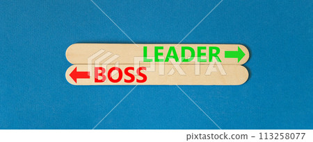 Leader or boss symbol. Concept word Leader or Boss on beautiful wooden stick. Beautiful blue table blue background. Business and leader or boss concept. Copy space. 113258077